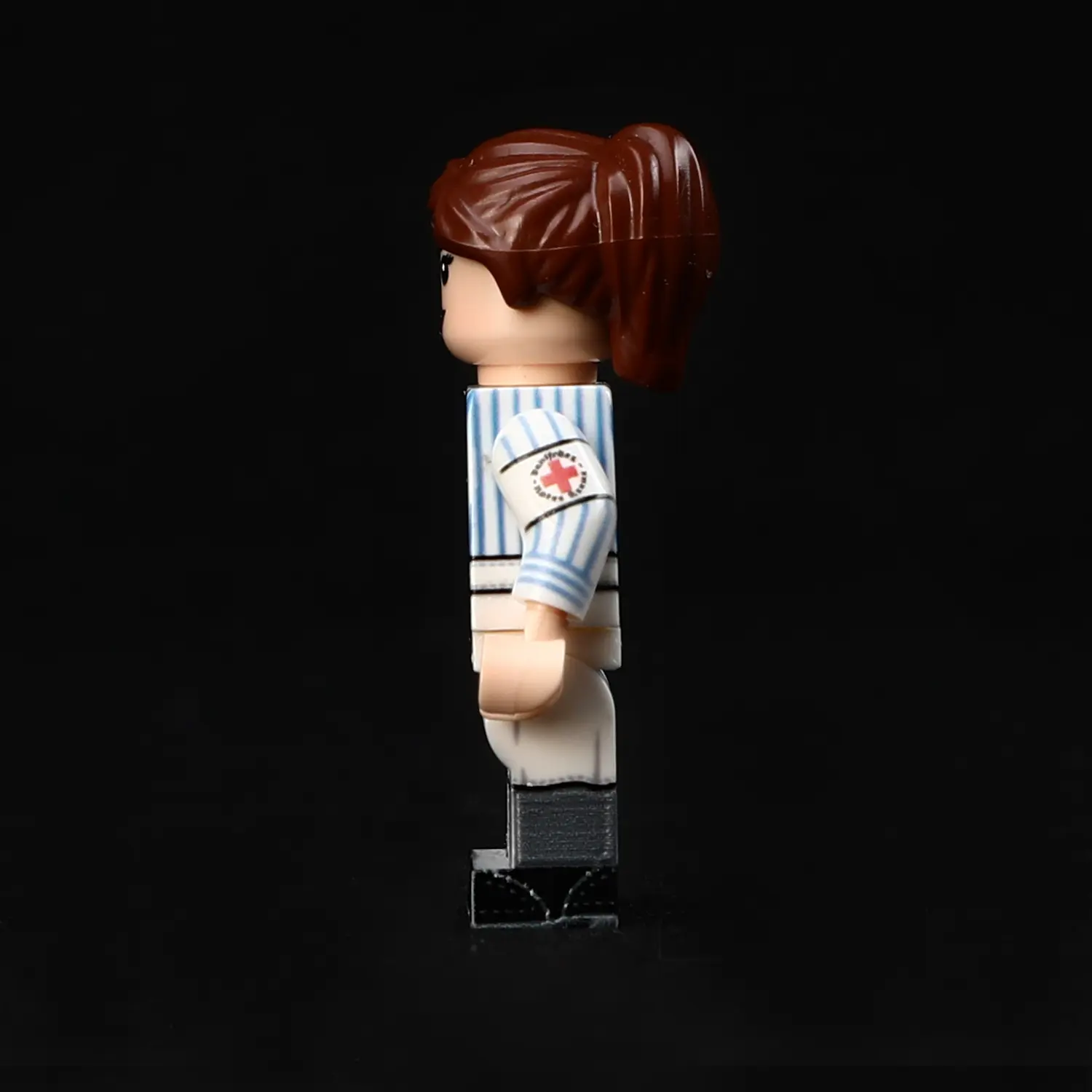the left side of Minifigure - German medical Charlotte female nurse from the World War II era (LEGO Compatible)