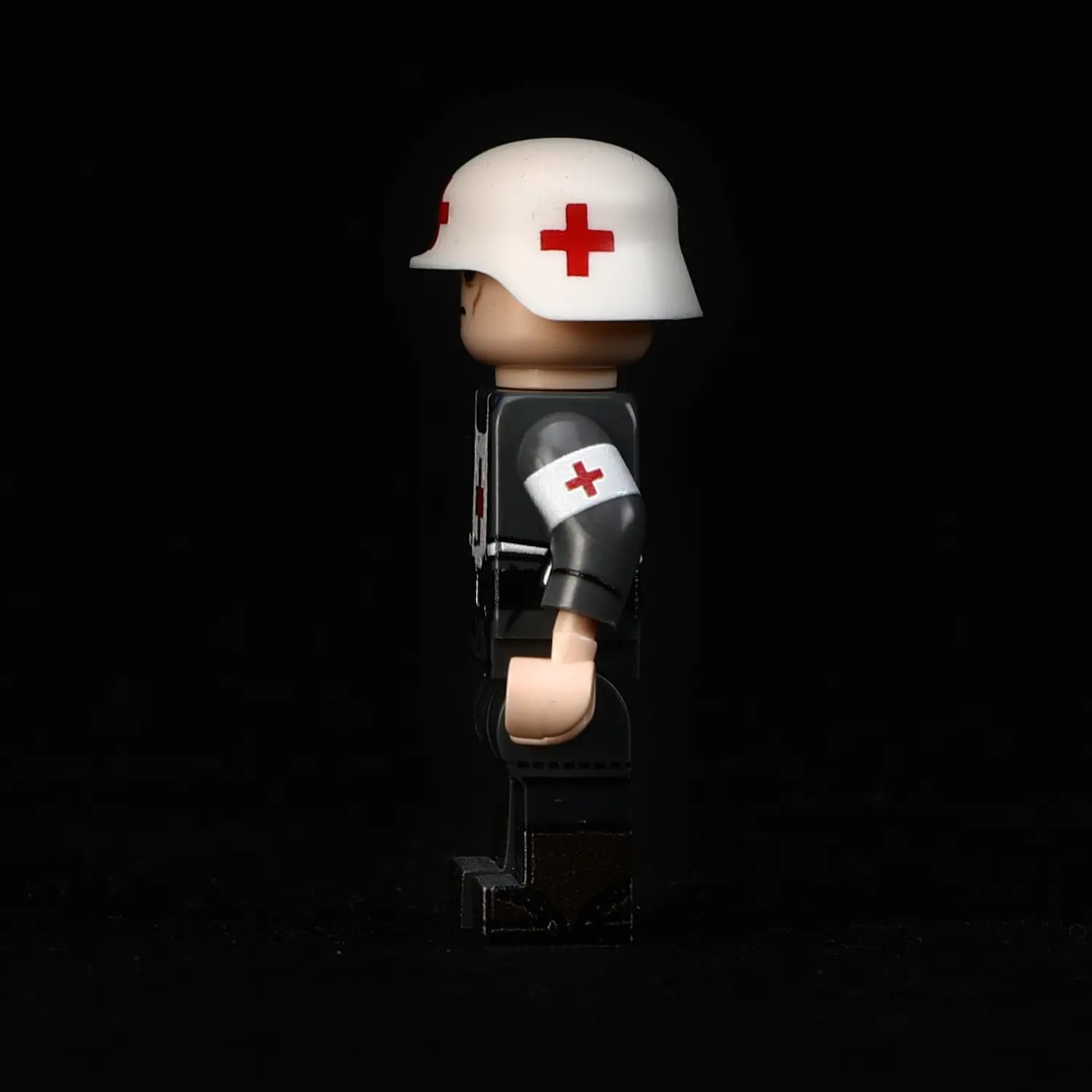 the left side ofMinifigure - German combat medic (Sanitäter) World War II (LEGO Compatible)