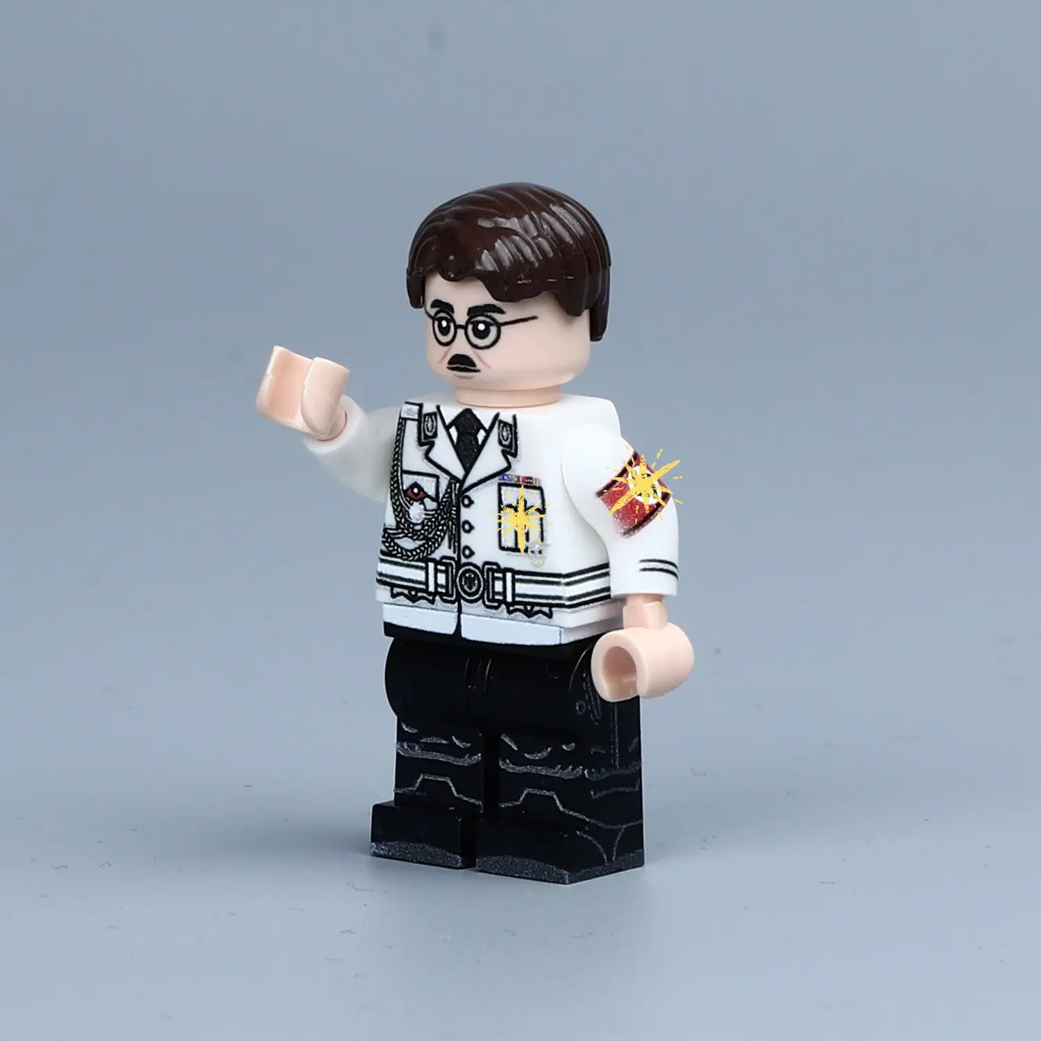 the left side of Minifigure - Adolf Hitler the Nazi Party NSDAP and dictator of Germany in white uniform (LEGO Compatible)