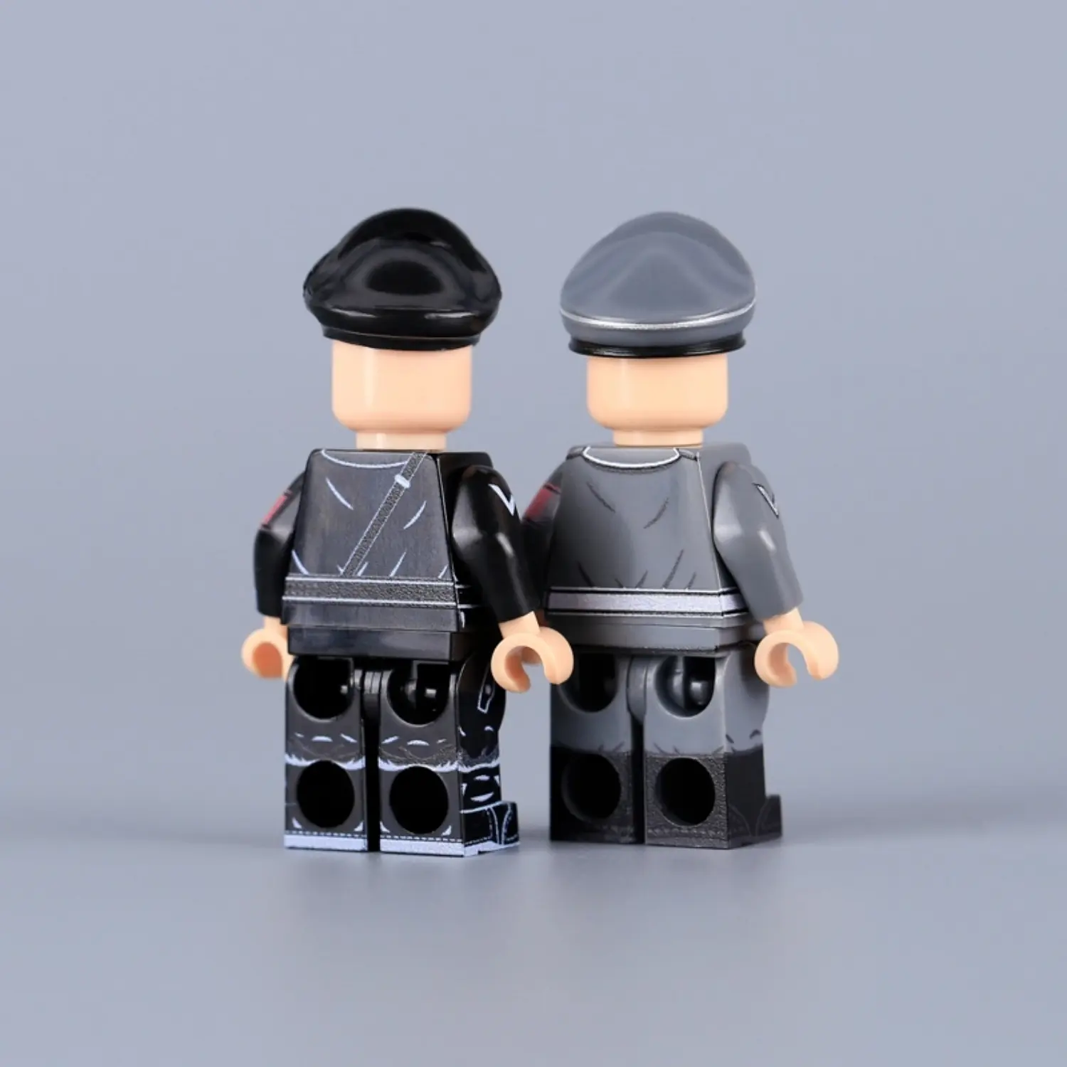 the back of Minifigure - Reinhard Heydrich, a high-ranking SS and police general and a principal architect of the Holocaust during World War II, shown in two different uniforms (LEGO Compatible)