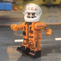 the left side of the Minifigure – Yuri Gagarin (Soviet Cosmonaut) (The First Human in Space) (LEGO Compatible)